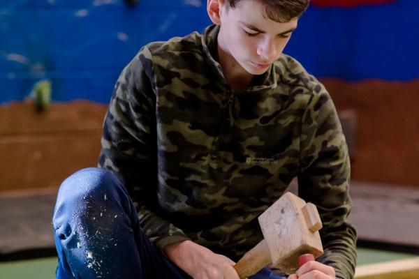 Young man woodworking